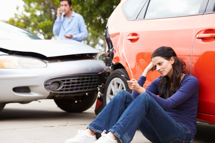 Woman calling her insurance company after an accident Woman calling her insurance company after an accident